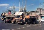 ID 305 British Leyland trucks sit forlornly on the quayside at the former Kings Wharf, Auckland, NZ. The trucks had been used - to destruction it seems - during construction of the Rarotonga International...